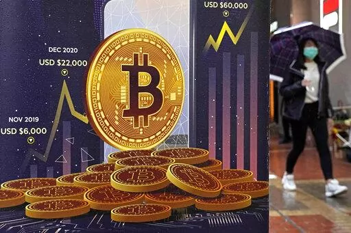An advertisement for Bitcoin cryptocurrency is displayed on a street in Hong Kong, on Feb. 17, 2022. Europe is poised to take the global lead in regulating the freewheeling cryptocurrency industry at a time when prices have plunged, wiping out fortunes, fueling skepticism and sparking calls for tighter scrutiny. European Union negotiators were set to hold talks on Thursday, June 30, 2022, to hammer out the final details in the bloc's sweeping package of crypto rules. (AP Photo/Kin Cheung, File)