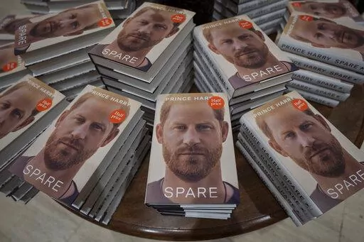 Copies of the new book by Prince Harry called "Spare" are displayed at a book store in London, Jan. 10, 2023. Prince Harry’s explosive memoir, with its damning allegations of a toxic relationship between the monarchy and the press, is likely to accelerate the pace of change already under way within the House of Windsor following the death of Queen Elizabeth II. (AP Photo/Kin Cheung, File)