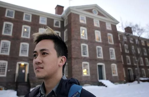 In this Feb. 14, 2017 file photo, Viet Nguyen poses for a portrait on the Brown University campus in Providence, R.I. Nguyen, now an alumnus, helped lead an effort urging Brown and other elite universities to rethink their legacy admissions policies. “Now more than ever, there’s no justification for allowing this process to continue,” said Viet Nguyen, a graduate of Brown and Harvard who leads Ed Mobilizer, a nonprofit that has fought legacy preferences since 2018. “No other country in t