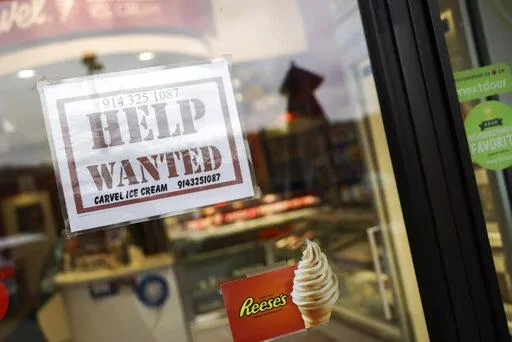 A help wanted sign is shown in a storefront on Nov. 1, 2022, in Bedford, N.Y. The Federal Reserve's move Wednesday, Dec. 14, to raise its key rate by a half-point brought it to a range of 4.25% to 4.5%, the highest level in 14 years. (AP Photo/Julia Nikhinson, File)