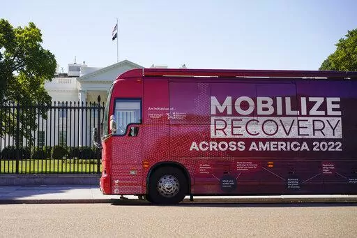 The Mobilize Recovery bus is parked on Pennsylvania Avenue in front of the White House in Washington, Friday, Sept. 23, 2022. Members of Mobilize Recover and others are in Washington to meet with Doug Emhoff, husband of Vice President Kamala Harris, to give their recommendations for the distribution of the federal settlement money as billions of dollars in opioid lawsuit settlements are starting to flow to governments. (AP Photo/Carolyn Kaster)