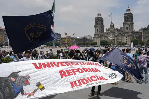 Supporters arrive to attend a rally in favor of the government's proposed judicial reform outside the Supreme Court building in Mexico City, Sept. 5, 2024. (AP Photo/Eduardo Verdugo, File)