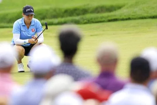 Ally Ewing lines up a putt on the 13th green during the third round of the LPGA Tour Kroger Queen City Championship golf tournament in Cincinnati, Saturday, Sept. 10, 2022. (AP Photo/Aaron Doster)