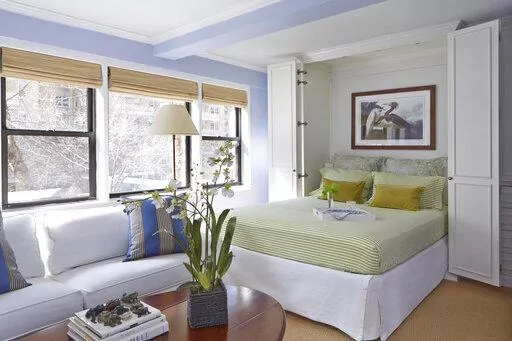 This image provided by Higgins Design Studio shows an open Murphy bed. (Mentis Photography/Higgins Design Studio via AP)