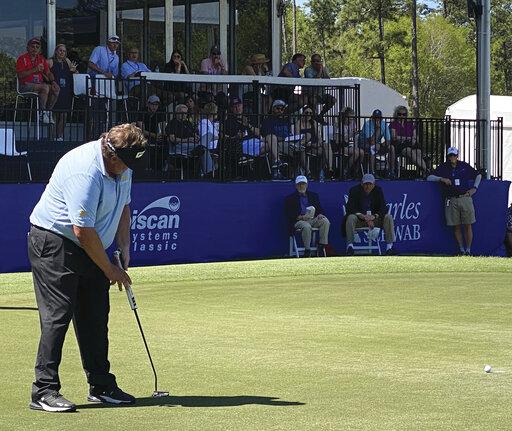 Champions Senior PGA Tour Player Tim Herron sinks a par-saving putt on the final 18th hole at Grand Bear Golf Club in Saucier, Miss. on April 3, 2022. (Hunter Dawkins/The Gazebo Gazette via AP)