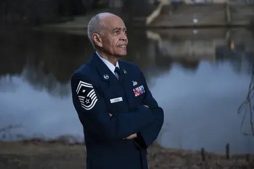 Calvin Stevens, Air Force Reserve Veteran, poses outside his home in Decatur, Georgia on Thursday, Feb. 7, 2025. (AP Photo/Olivia Bowdoin)