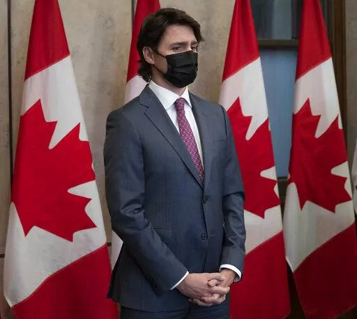 Prime Minister Justin Trudeau attends news conference on Monday, Feb. 14, 2022 in Ottawa. Trudeau says he has invoked the Emergencies Act to bring to an end antigovernment blockades he describes as illegal and not about peaceful protest. (Adrian Wyld/The Canadian Press via AP)