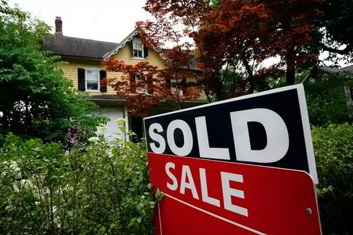 A sale sign stands outside a home in Wyndmoor, Pa., June 22, 2022. One of the nation's largest real estate brokerages has agreed Thursday, Feb. 1, 2024, to pay $70 million as part of a proposed settlement to resolve more than a dozen lawsuits across the country over agent commissions. (AP Photo/Matt Rourke, File)