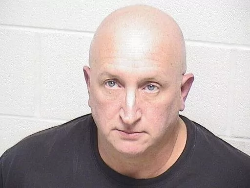 This image provided by the Lake County Sheriff's Office in Waukegan, Ill., shows Robert Crimo Jr., on Friday, Dec. 16, 2022, after turning himself in. Crimo Jr.,, the father of an Illinois man charged with killing seven people in a mass shooting at a July 4 parade in a Chicago suburb has been charged with seven felony counts of reckless conduct, prosecutors announced Friday. (Lake County Sheriff's Office via AP)