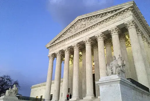 The Supreme Court at sunset in Washington, Feb. 13, 2016. (AP Photo/Jon Elswick, File)
