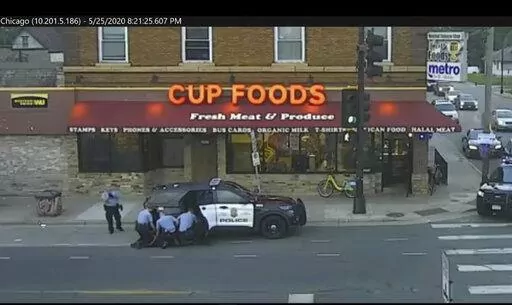 In this image from surveillance video, Minneapolis police Officers from left, Tou Thao, Derek Chauvin, J. Alexander Kueng and Thomas Lane are seen attempting to take George Floyd into custody in Minneapolis, Minn on May 25, 2020. Three former Minneapolis officers headed to trial this week on federal civil rights charges in the death of George Floyd aren't as familiar to most people as Chauvin, a fellow officer who was convicted of murder last spring. (Court TV via AP, Pool, File)