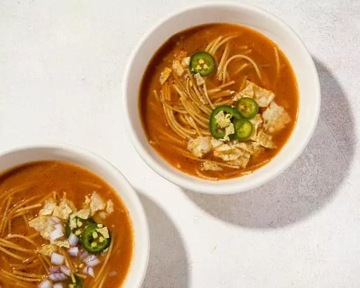 This image released by Milk Street shows a recipe for Mexican noodle soup with fire-roasted tomatoes. (Milk Street via AP)