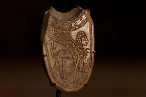 A 2,700-year-old ivory incense spoon plundered from a site in the occupied West Bank — seized in late 2021 by the Manhattan District Attorney's office as part of a plea deal with billionaire hedge fund manager Michael Steinhardt, displayed at the Palestinian Ministry of Tourism and Antiquities in the West Bank city of Bethlehem, Thursday, Jan. 19, 2023. Earlier this month, American officials handed over the artifact to the Palestinians in what the U.S. State Department's Office of Palestinian 