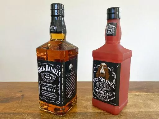 A bottle of Jack Daniel's Tennessee Whiskey is displayed next to a Bad Spaniels dog toy in Arlington, Va., Sunday, Nov. 20, 2022. Jack Daniel's has asked the Supreme Court justices to hear its case against the manufacturer of the toy. (AP Photo/Jessica Gresko)