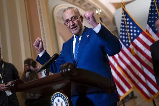 Senate Majority Leader Chuck Schumer, D-N.Y., speaks with reporters following a closed-door caucus lunch, at the Capitol in Washington, June 22, 2022. Senate Democrats want to boost taxes on some high earners and use the money to extend the solvency of Medicare, the latest step in the party's election-year attempt to craft a scaled back version of the economic package that collapsed last year, Democratic aides have told The Associated Press. (AP Photo/J. Scott Applewhite, File)