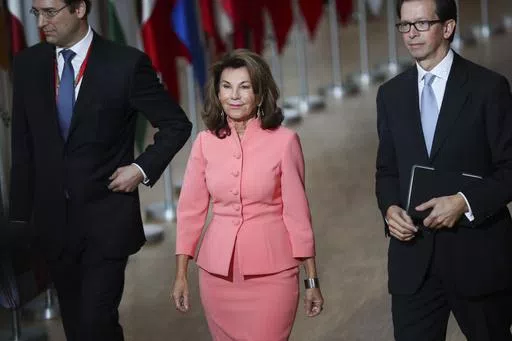 Austria's Chancellor Brigitte Bierlein, center, arrives for an EU summit at the Europa building in Brussels, Thursday, Oct. 17, 2019. Brigitte Bierlein, a former head of Austria’s Constitutional Court who became the country’s first female chancellor in an interim government after the previous administration collapsed in a scandal in 2019, has died. (AP Photo/Francisco Seco, File)
