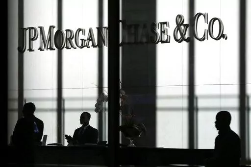 The JPMorgan Chase & Co. logo is displayed at their headquarters in New York on Oct. 21, 2013. You'll no longer be able to store your precious coins, jewelry and paperwork at JPMorgan Chase & Co., as the bank has stopped opening new safety deposit boxes for customers. A spokesman for the bank said Chase decided late last year to stop offering new deposit boxes to customers as a “business decision” but declined to share specifics. (AP Photo/Seth Wenig, File)