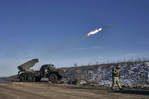 Ukrainian army Grad multiple rocket launcher fires rockets at Russian positions in the frontline near Soledar, Donetsk region, Ukraine, Wednesday, Jan. 11, 2023. Russia's Defense Ministry said Friday Jan. 13, 2023 that its forces have captured the salt-mining town of Soledar, the focus of a bloody battle between Russian and Ukrainian forces for months. (AP Photo/Libkos, File)