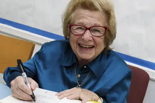Dr. Ruth Westheimer signs a copy of her book "Sexually Speaking" in New York on April 26, 2012. (AP Photo/Richard Drew, File)