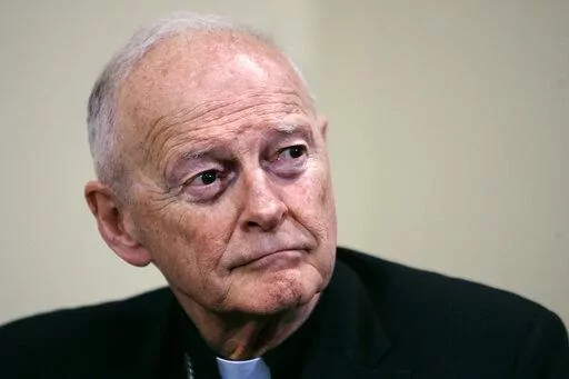 Former Washington Archbishop, Cardinal Theodore McCarrick listens during a press conference in Washington, May 16, 2006. Lawyers for former Roman Catholic Cardinal McCarrick filed a motion Monday, Feb. 27, 2023, to dismiss a case charging him with sexually assaulting a boy decades ago, saying the 92-year-old once-powerful American prelate has dementia and is not competent to stand trial. (AP Photo/J. Scott Applewhite, File)