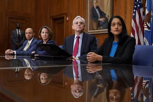 Attorney General Merrick Garland, center, listens at a news conference about the Justice Department's intervention to try to bring improvements to the beleaguered water system in Jackson, Miss., at the Justice Department in Washington on Nov. 30, 2022. Attorneys for the federal government, Mississippi and the state's capital city have agreed to request a stay on litigation from a complaint filed by the U.S. Environmental Protection Agency that said the city wasn’t meeting standards for providi