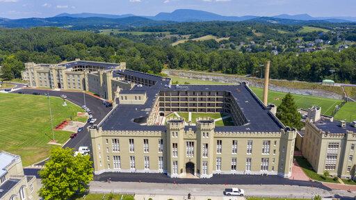 This July 15, 2020, file photo shows the barracks at Virginia Military Institute in Lexington, Va. The Virginia Military Institute will change its student-run honor court to make it more fair to cadets as part of a response to a state-ordered investigation into racism and sexism. The Washington Post reports VMI detailed the reforms in a progress report Friday, Feb. 4, 2022. (AP Photo/Steve Helber, File)