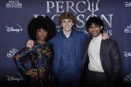 Leah Sava Jeffries, from left, Walker Scobell and Aryan Simhadri pose for photographers upon arrival at the premiere of the television series 'Percy Jackson and the Olympians' in London Saturday, Dec. 16, 2023. (Photo by Vianney Le Caer/Invision/AP)