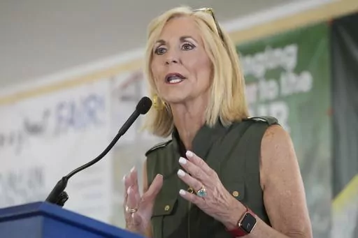 Mississippi Republican Attorney General Lynn Fitch addresses the crowd at the Neshoba County Fair in Philadelphia, Miss., July 26, 2023. A court ruling striking down Mississippi's practice of permanently stripping voting rights from people convicted of certain felonies should be reconsidered and reversed, the state said Friday, Aug. 18, 2023, as it asked for new hearing by the 5th U.S. Circuit Court of Appeals. Enforcement of the voting ban, which is part of the state's constitution, was blocked