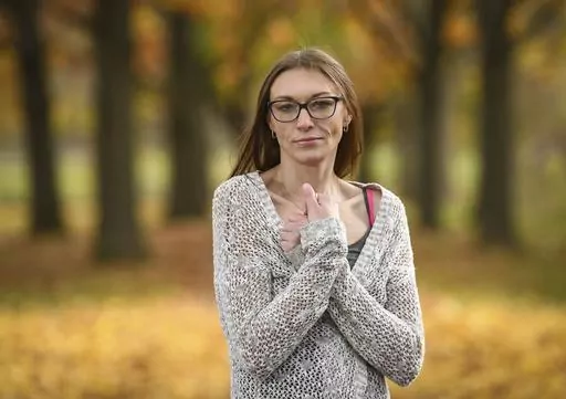 Alexandria Johnson, 35, stands for a photo, Thursday, Nov. 2, 2023, in Oneonta, N.Y. Johnson filed separate lawsuits against New York City and the state corrections department under the Adult Survivors Act, alleging repeated sexual assaults while she was incarcerated at Rikers Island, as well as at the state's Bedford Hills facility that led to the termination of her pregnancy. "I had to take a chance that there would be justice," said Johnson, of her decision to file the law suits. (AP Photo/He