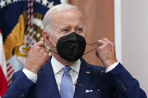 President Joe Biden removes his face mask as he arrives to speak about the economy during a meeting with CEOs in the South Court Auditorium on the White House complex in Washington, Thursday, July 28, 2022. Biden tested positive for COVID-19 again Saturday, July 30, slightly more than three days after he was cleared to exit coronavirus isolation, the White House said, in a rare case of “rebound” following treatment with an anti-viral drug. (AP Photo/Susan Walsh, File)