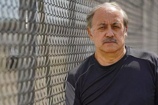 Dave Muffley poses outside one of the Delphi Corporation plants in Kokomo, Ind., Monday, July 11, 2022. As General Motors Corp. underwent the biggest industrial bankruptcy proceedings in history, and the federal government negotiated a company restructuring, Muffley's healthy retirement savings would be slashed by 70 percent, and his life's trajectory would take a dramatic spiral downward. (AP Photo/Michael Conroy)