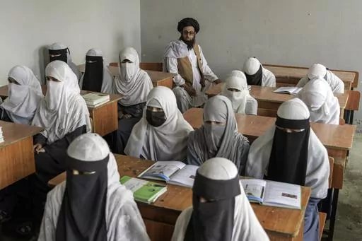Afghan girls attend a religious school, which remained open since the last year's Taliban takeover, in Kabul, Afghanistan, on Aug. 11, 2022. Two years after the Taliban banned girls from school beyond sixth grade, Afghanistan is the only country in the world with restrictions on female education. Now, the rights of Afghan women and children are on the agenda of the United Nations General Assembly Monday, Sept. 18, 2023, in New York. (AP Photo/Ebrahim Noroozi, File)