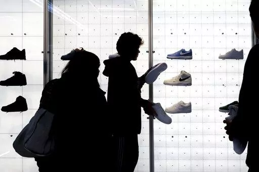 People shop for shoes in a Nike store on , Nov. 25, 2022, in New York. “Buy now, pay later” services like Affirm, Afterpay and Klarna can sometimes provide a cheaper, more accessible version of credit. These services essentially provide customers an alternative way to pay for purchases over time without going into credit card debt or taking out a traditional personal loan. Travel purchases, such as airfare and vacation rentals, are the fastest-growing segment for buy now, pay later services.