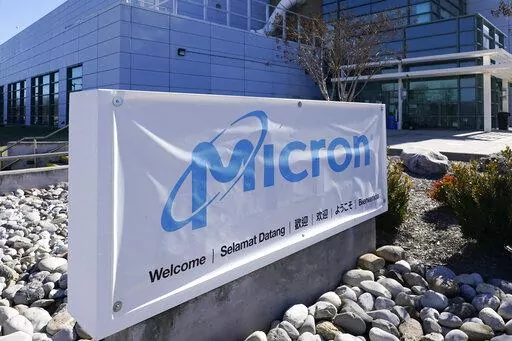 A sign marks the entrance of the Micron Technology automotive chip manufacturing plant on Feb. 11, 2022, in Manassas, Va. Micron, one of the world’s largest microchip manufacturers, is expected to open a semiconductor plant in New York, promising a $100 billion investment and a plant that could bring 50,000 jobs to the state. Senate Majority Leader Charles Schumer confirmed the company's plan to The Associated Press after speaking to its leaders. (AP Photo/Steve Helber, File)