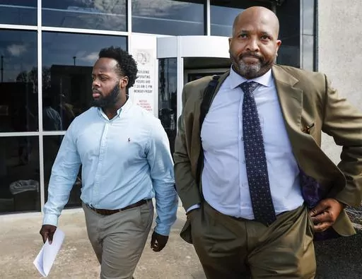 Former Memphis Police officer Desmond Mills Jr., left, along with his attorney John Keith Perry leave the Odell Horton Federal Courthouse on Wednesday, Sept. 13, 2023, in Memphis, Tenn. Mills and four other former Memphis police officers were charged with federal civil rights violations in the beating death of Tyre Nichols. (Mark Weber/The Daily Memphian)