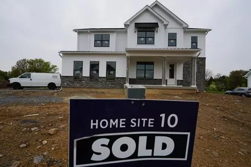 A home under construction at a development in Eagleville, Pa., is shown on Friday, April 28, 2023. Rates on credit cards, mortgages and auto loans, which have been surging since the Fed began raising rates last year, all stand to rise even more. (AP Photo/Matt Rourke)