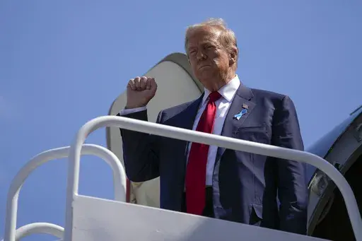 Republican presidential nominee former President Donald Trump arrives in Johnstown, Pa., en route to the Flight 93 Memorial, Wednesday, Sept. 11, 2024. (AP Photo/Matt Rourke)