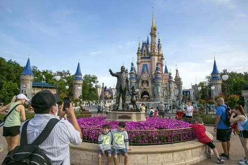 People visit the Magic Kingdom Park at Walt Disney World Resort in Lake Buena Vista, Fla., April 18, 2022. Ongoing strength at its theme parks and an improving streaming business propelled The Walt Disney Co. to higher profits and revenue in its fiscal second quarter in 2023. (AP Photo/Ted Shaffrey, File)