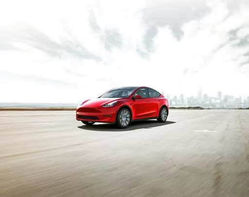 This photo provided by Toyota, shows the 2022 Tesla Model 3, an all-electric SUV that has an estimated maximum range of about 330 miles. (Courtesy of Tesla Motors via AP)