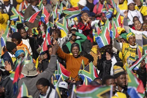 South Africans gather ahead of the inauguration of South Africa's Cyril Ramaphosa as President at the Union Buildings South Lawns in Pretoria, South Africa, on June 19, 2024. In a country where racial segregation was once brutally enforced, South Africa's new coalition government has brought a Black president and a white opposition leader together in what is on the face of it a picture of unity. (AP Photo/Jerome Delay, File)