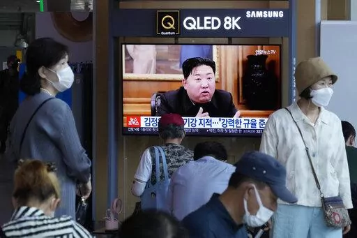 People watch a TV showing an image of North Korea leader Kim Jong Un during a news program at the Seoul Railway Station in Seoul, South Korea, Monday, June 13, 2022. Kim and his top deputies have pushed for a crackdown on officials who abuse their power and commit other "unsound and non-revolutionary acts," state media reported Monday, as Kim seeks greater internal unity to overcome a COVID-19 outbreak and economic difficulties. (AP Photo/Ahn Young-joon)
