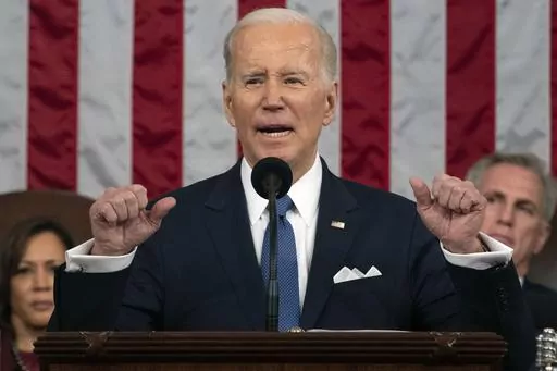 President Joe Biden delivers the State of the Union address to a joint session of Congress at the U.S. Capitol, Feb. 7, 2023, in Washington, as Vice President Kamala Harris and House Speaker Kevin McCarthy of Calif., listen. Biden's upcoming budget proposal aims to trim deficits by nearly $3 trillion over the next decade. That's according to an administration official who insisted on anonymity to discuss the figures being released Thursday. The level of deficit reduction is significantly higher 