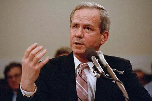 Former national security adviser Robert C. McFarlane gestures while testifying before the House-Senate panel investigating the Iran-Contra affair on Capitol Hill in Washington, May 13, 1987. McFarlane, a top aide to President Ronald Reagan who pleaded guilty to charges for his role in an illegal arms-for-hostages deal known as the Iran-Contra affair, died Thursday, May 12, 2022. He was 84. (AP Photo/Lana Harris, File)