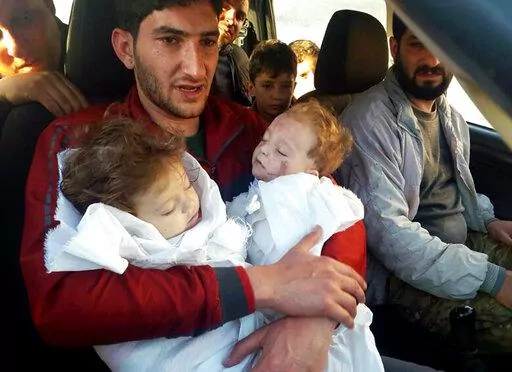 Abdel Hameed Alyousef, 29, holds his twin babies who were killed during a suspected chemical weapons attack, in Khan Sheikhoun in the northern province of Idlib, Syria, April 4, 2017. Legal and moral taboos were shattered with the use of chemical weapons during Syria's civil war. Hundreds were killed in poison gas attacks widely blamed on President Bashar Assad’s forces under the protection of his chief ally, Russian leader Vladimir Putin. Several years later, concerns are growing that such we