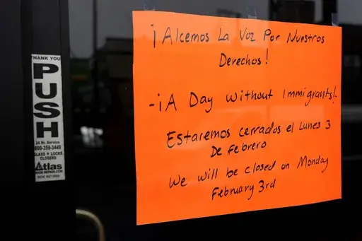 A closed sign is displayed at a local business in the Little Village neighborhood of Chicago to stand with immigrants in Chicago, Monday, Feb. 3, 2025. (AP Photo/Nam Y. Huh)