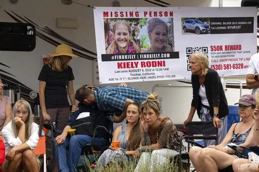 Lindsey Rodni-Nieman, center, mother of missing 16-year-old Kiely Rodni, listens to law enforcement during a news conference, Tuesday, August 9, 2022, in Truckee, Calif. (Paul Kitagaki Jr./The Sacramento Bee via AP)