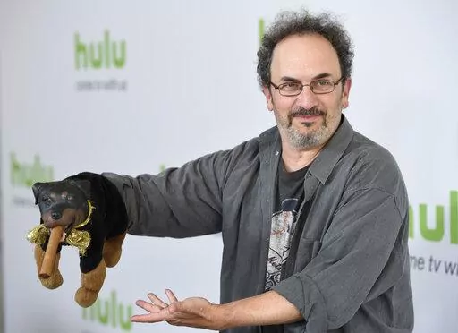Robert Smigel, creator, executive producer and voice of "Triumph the Insult Comic Dog," poses with the puppet during the Television Critics Association 2016 Summer Press Tour at the Beverly Hilton on Aug. 5, 2016, in Beverly Hills, Calif. Federal prosecutors on Monday, July 18, 2022, declined to bring charges against Smigel and eight others associated with CBS’ “Late Show with Stephen Colbert” who were arrested in a building in the U.S. Capitol complex last month. (Photo by Chris Pizzello/