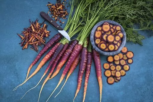 This image provided by Baker Creek Heirloom Seed Co. shows Lila Lu Sang carrots, which are deep purple on the outside and bright orange on the inside. (Baker Creek Heirloom Seed Co./rareseeds.com via AP)