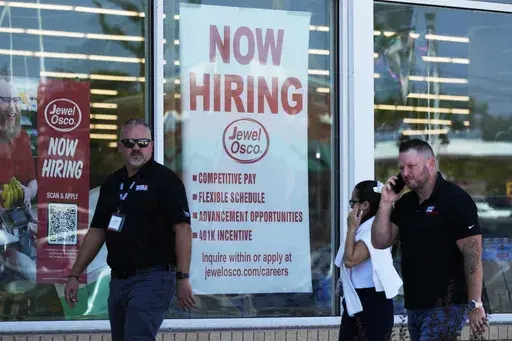 A hiring sign is displayed at a grocery store in Deerfield, Ill., Thursday, July 25, 2024. On Thursday, Aug. 1, 2024, the Labor Department reports on the number of people who applied for unemployment benefits last week. (AP Photo/Nam Y. Huh, File)