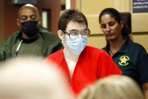 Nikolas Cruz enters the courtroom for a hearing at the Broward County Courthouse in Fort Lauderdale, Fla., on Wednesday, March 29, 2022. Cruz previously plead guilty to all 17 counts of premeditated murder and 17 counts of attempted murder in the 2018 shootings at Marjory Stoneman Douglas High School . (Amy Beth Bennett/South Florida Sun-Sentinel via AP, Pool)